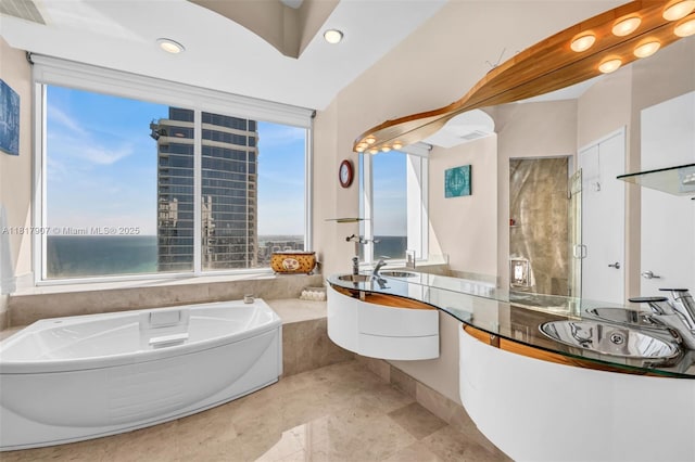 18101 Collins Ave Unit 5401, Sunny Isles Beach, FL 33160 - full bath with plenty of natural light, a bath, vanity, and recessed lighting