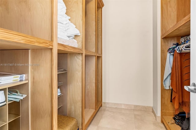 18101 Collins Ave Unit 5401, Sunny Isles Beach, FL 33160 - walk in closet featuring tile patterned floors