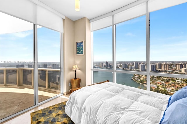 18101 Collins Ave Unit 5401, Sunny Isles Beach, FL 33160 - bedroom featuring floor to ceiling windows, a water view, a view of city, and access to exterior