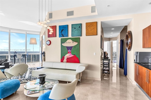 18101 Collins Ave Unit 5401, Sunny Isles Beach, FL 33160 - living area featuring baseboards and floor to ceiling windows
