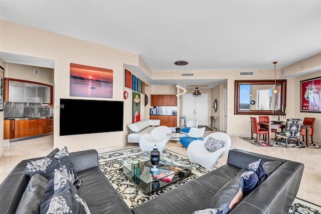 18101 Collins Ave Unit 5401, Sunny Isles Beach, FL 33160 - living room featuring light tile patterned floors and a chandelier