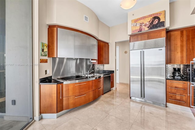 18101 Collins Ave Unit 5401, Sunny Isles Beach, FL 33160 - kitchen with stainless steel built in fridge, stainless steel counters, dishwasher, modern cabinets, and brown cabinetry