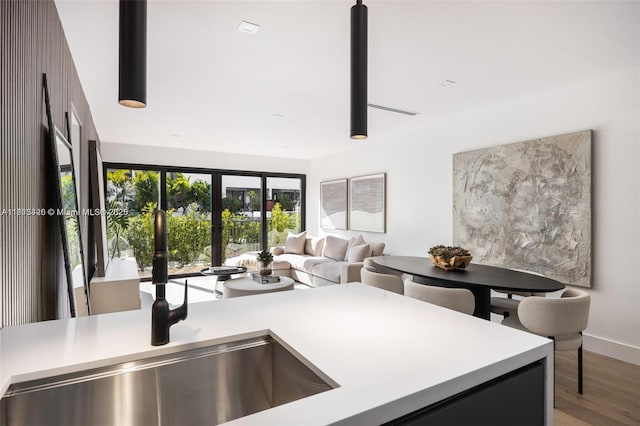 200 Sunrise Dr Unit 200A, Key Biscayne, FL 33149 - kitchen with a sink, wood finished floors, light countertops, and open floor plan