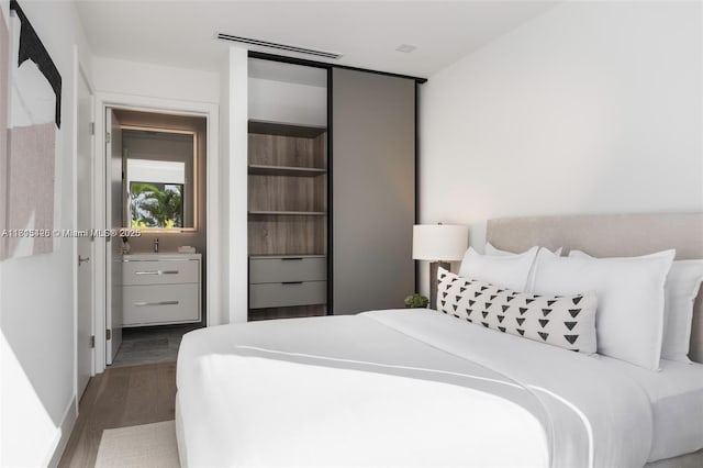 200 Sunrise Dr Unit 200A, Key Biscayne, FL 33149 - bedroom featuring wood finished floors