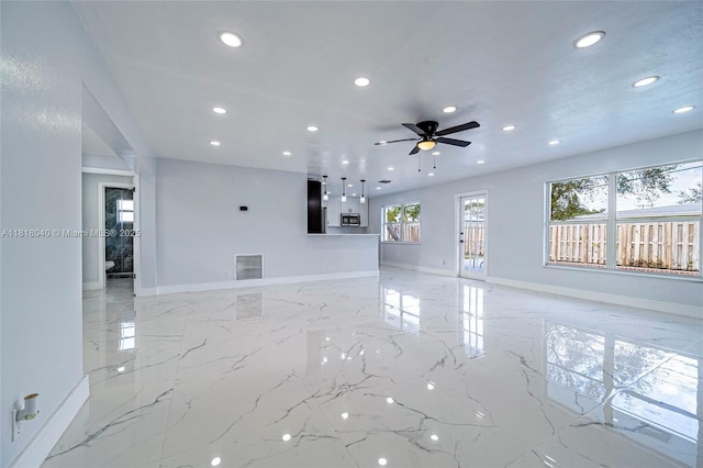 6113 NW 18th St, Margate, FL 33063 - unfurnished living room featuring recessed lighting, light marble finish flooring, ceiling fan, and baseboards
