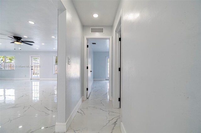 6113 NW 18th St, Margate, FL 33063 - hall with light marble finish floors, baseboards, and recessed lighting