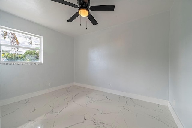 6113 NW 18th St, Margate, FL 33063 - spare room with baseboards, marble finish flooring, and ceiling fan