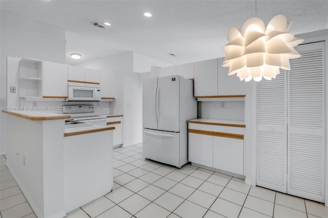 1061 NW 191st Ave, Pembroke Pines, FL 33029 - kitchen with white appliances, open shelves, light countertops, white cabinetry, and a peninsula