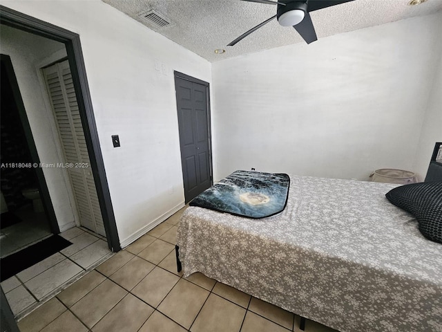 3434 SW 112th Ave Unit 3-2, Miami, FL 33165 - bedroom with a textured ceiling, tile patterned floors, and ceiling fan