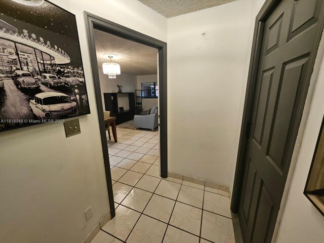 3434 SW 112th Ave Unit 3-2, Miami, FL 33165 - hall featuring a textured ceiling and light tile patterned floors
