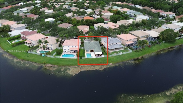 4221 Laurel Ridge Cir, Weston, FL 33331 - aerial view of property and surrounding area featuring property parcel outlined, a large body of water, a pool area, and nearby suburban area
