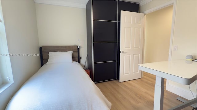 4221 Laurel Ridge Cir, Weston, FL 33331 - unfurnished bedroom with light wood-style flooring and ornamental molding