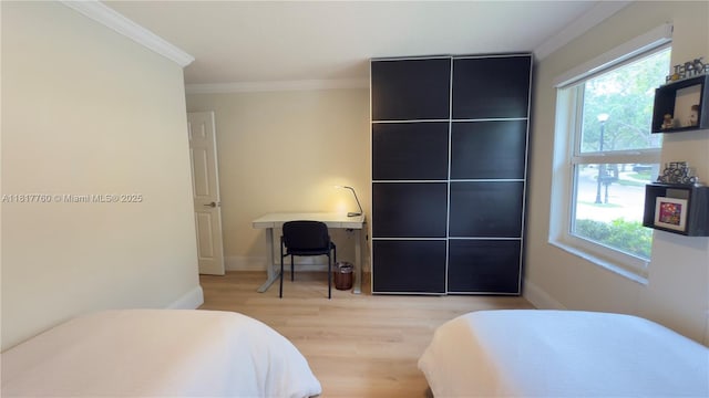 4221 Laurel Ridge Cir, Weston, FL 33331 - bedroom with light wood-type flooring and ornamental molding