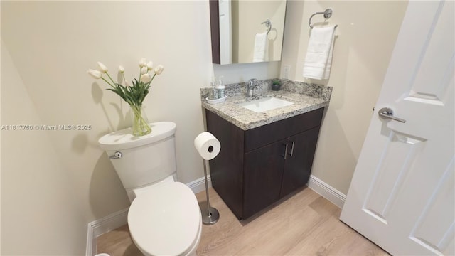 4221 Laurel Ridge Cir, Weston, FL 33331 - half bathroom featuring vanity and wood finished floors