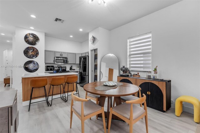 685 SE 34th Ter, Homestead, FL 33033 - dining room featuring light wood-style floors and recessed lighting