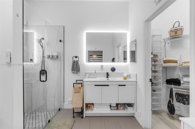 685 SE 34th Ter, Homestead, FL 33033 - bathroom with a shower stall, vanity, and a walk in closet