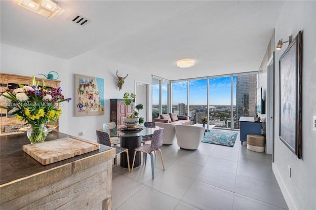 1040 Biscayne Blvd Unit 3607, Miami, FL 33132 - dining room featuring expansive windows, tile patterned floors, and baseboards