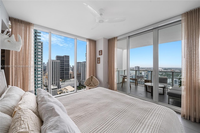 1040 Biscayne Blvd Unit 3607, Miami, FL 33132 - bedroom featuring a wall of windows, access to exterior, a city view, and a ceiling fan