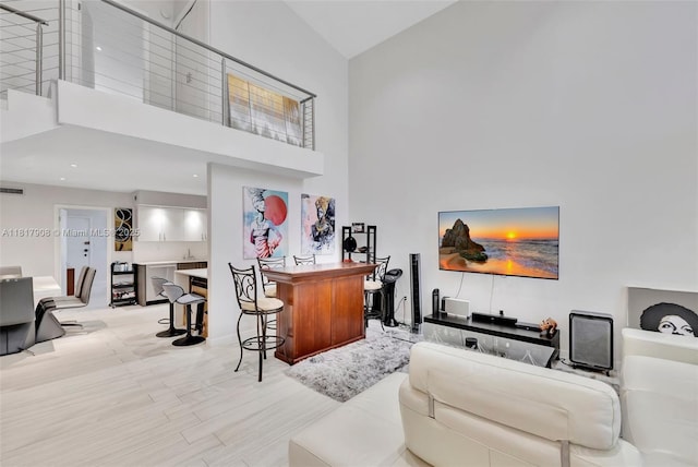2730 NE 183rd St Unit Th03, Aventura, FL 33160 - living room featuring high vaulted ceiling and baseboards