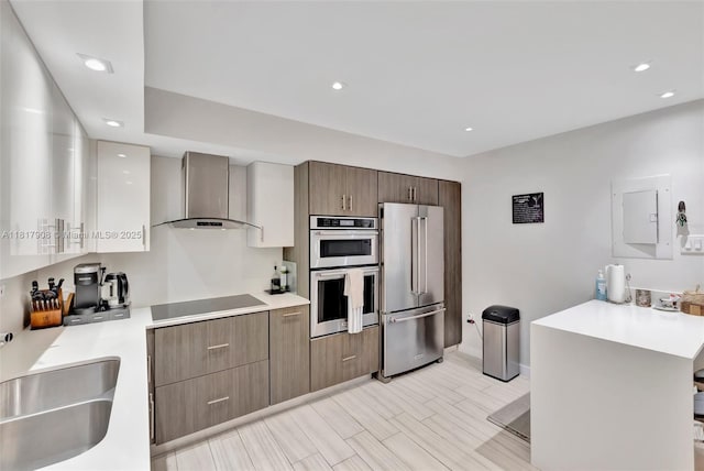 2730 NE 183rd St Unit Th03, Aventura, FL 33160 - kitchen featuring stainless steel appliances, wall chimney range hood, light countertops, baseboards, and recessed lighting