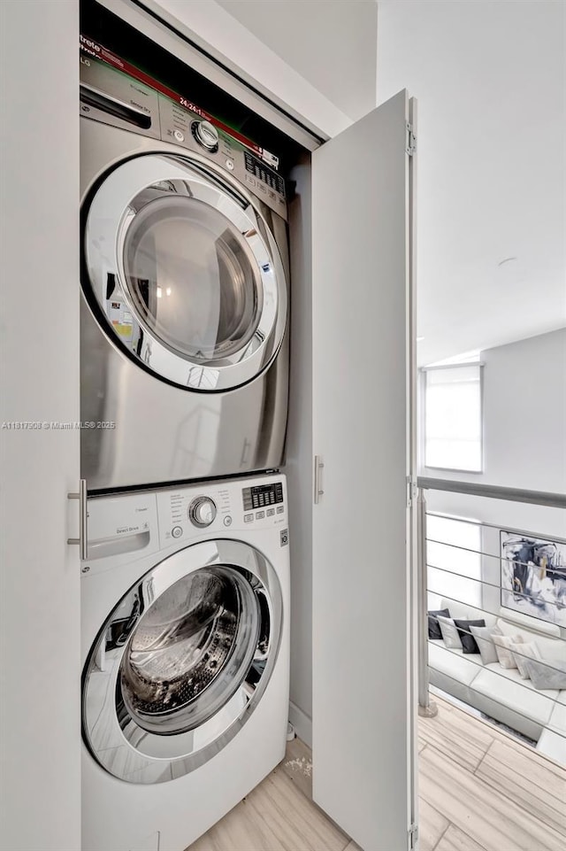 2730 NE 183rd St Unit Th03, Aventura, FL 33160 - laundry area with stacked washing machine and dryer