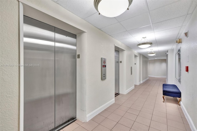 2730 NE 183rd St Unit Th03, Aventura, FL 33160 - hall with elevator, light tile patterned floors, baseboards, and a drop ceiling