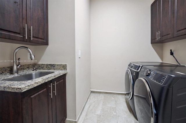 13357 SW 42nd St, Davie, FL 33330 - laundry room featuring washing machine and dryer, cabinet space, and baseboards
