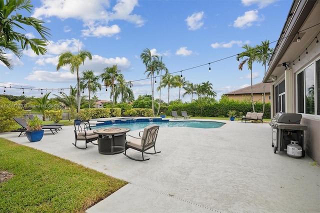13357 SW 42nd St, Davie, FL 33330 - view of swimming pool featuring an outdoor fire pit, a patio, and area for grilling