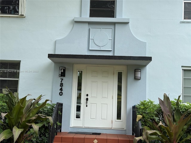 7840 SW 55th Ave Unit 23C, Miami, FL 33143 - doorway to property featuring stucco siding