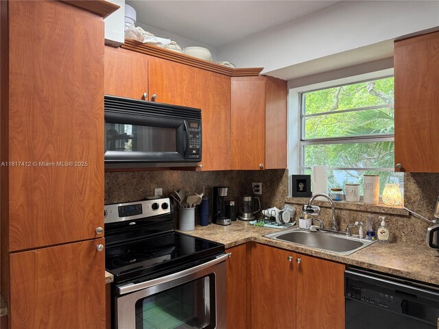 7840 SW 55th Ave Unit 23C, Miami, FL 33143 - kitchen featuring black appliances, decorative backsplash, brown cabinets, and light countertops