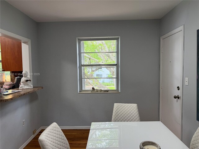 7840 SW 55th Ave Unit 23C, Miami, FL 33143 - dining room featuring dark wood finished floors and baseboards