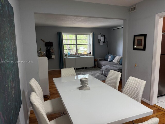 7840 SW 55th Ave Unit 23C, Miami, FL 33143 - dining space with wood finished floors and baseboards