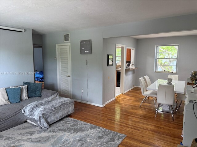 7840 SW 55th Ave Unit 23C, Miami, FL 33143 - living room featuring wood finished floors and baseboards