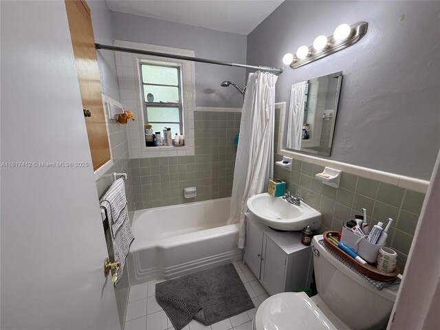 7840 SW 55th Ave Unit 23C, Miami, FL 33143 - full bath with tile walls, shower / bath combo, tile patterned floors, vanity, and a wainscoted wall