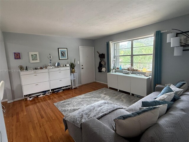 7840 SW 55th Ave Unit 23C, Miami, FL 33143 - living room with wood finished floors and baseboards