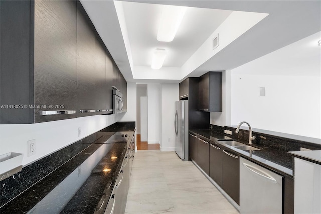 3030 NE 188th St Unit 609, Aventura, FL 33180 - kitchen featuring stainless steel appliances, a sink, dark stone countertops, modern cabinets, and baseboards
