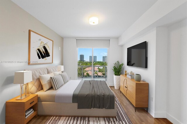 3030 NE 188th St Unit 609, Aventura, FL 33180 - bedroom with wood finished floors and baseboards