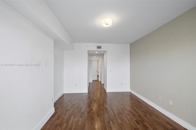 3030 NE 188th St Unit 609, Aventura, FL 33180 - unfurnished room featuring dark wood-style floors and baseboards