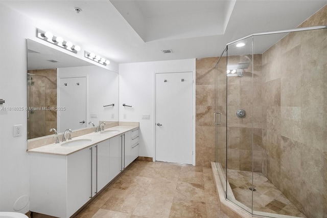 3030 NE 188th St Unit 609, Aventura, FL 33180 - bathroom with double vanity, a shower stall, and recessed lighting