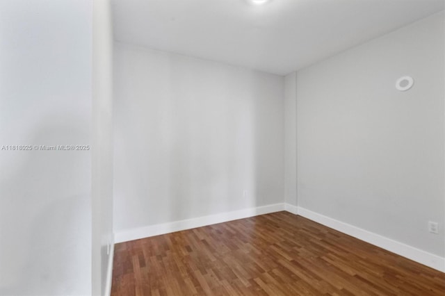 3030 NE 188th St Unit 609, Aventura, FL 33180 - empty room with wood finished floors and baseboards
