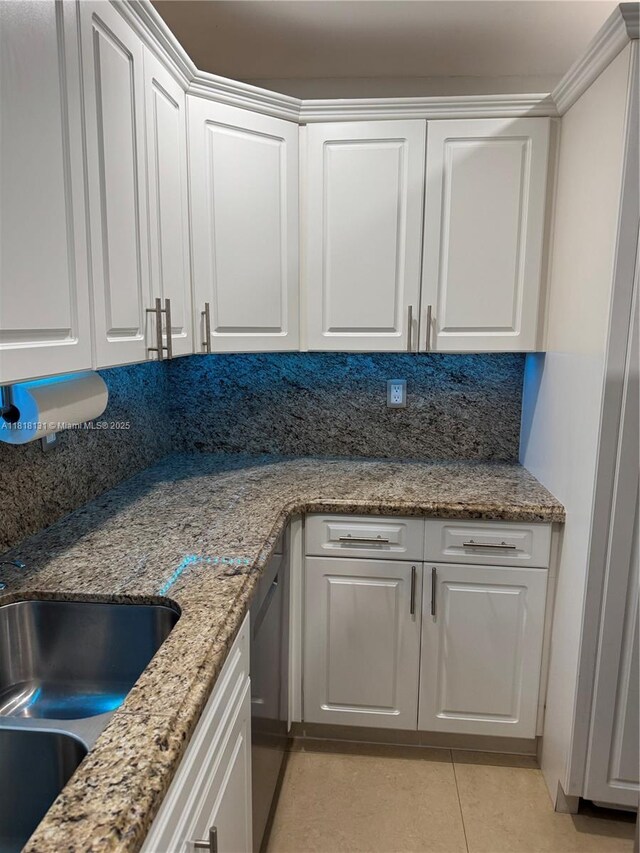 14036 SW 90th Ave Unit 201-Aa, Miami, FL 33176 - kitchen featuring white cabinets, light tile patterned flooring, and light stone counters