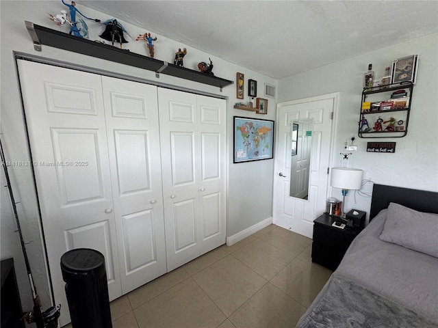 14036 SW 90th Ave Unit 201-Aa, Miami, FL 33176 - tiled bedroom with a closet and baseboards