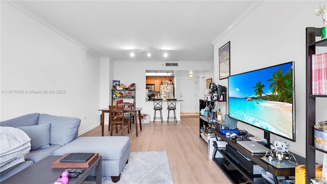 2000 N Bayshore Dr Unit 218, Miami, FL 33137 - living room with ornamental molding, wood finished floors, baseboards, and rail lighting