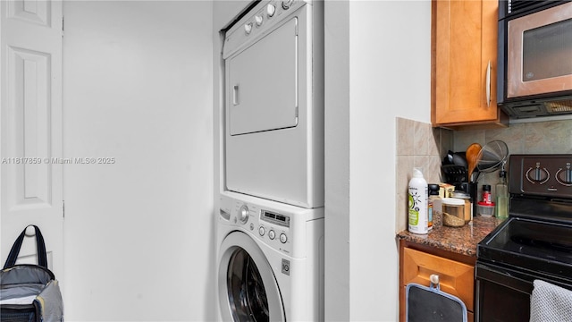 2000 N Bayshore Dr Unit 218, Miami, FL 33137 - washroom with stacked washer and clothes dryer