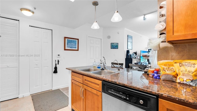 2000 N Bayshore Dr Unit 218, Miami, FL 33137 - kitchen featuring dishwasher, a sink, tasteful backsplash, and brown cabinetry