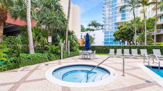 2000 N Bayshore Dr Unit 218, Miami, FL 33137 - view of pool with a hot tub, a patio area, and a swimming pool