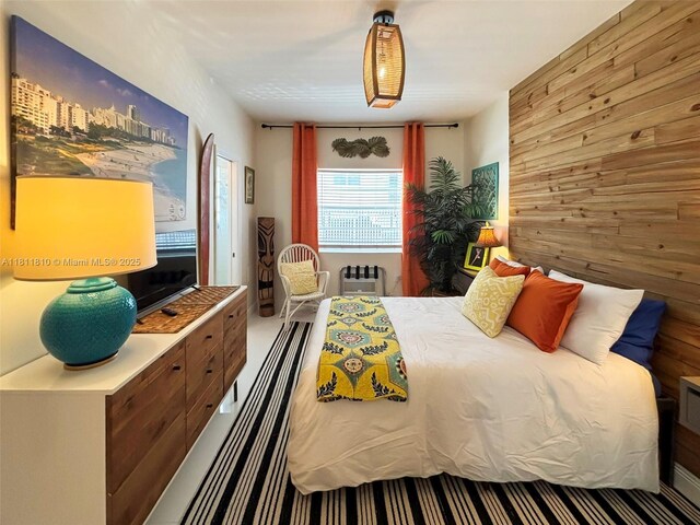 335 Ocean Dr Unit 114, Miami Beach, FL 33139 - bedroom featuring wood walls and radiator heating unit