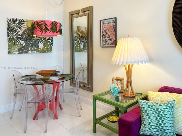 335 Ocean Dr Unit 114, Miami Beach, FL 33139 - tiled dining space with baseboards