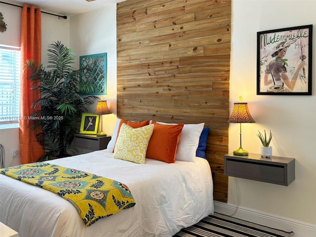 335 Ocean Dr Unit 114, Miami Beach, FL 33139 - bedroom featuring wooden walls