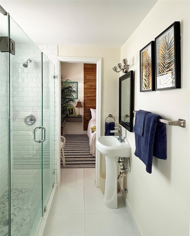 335 Ocean Dr Unit 114, Miami Beach, FL 33139 - full bath featuring ensuite bathroom, a shower stall, and tile patterned floors